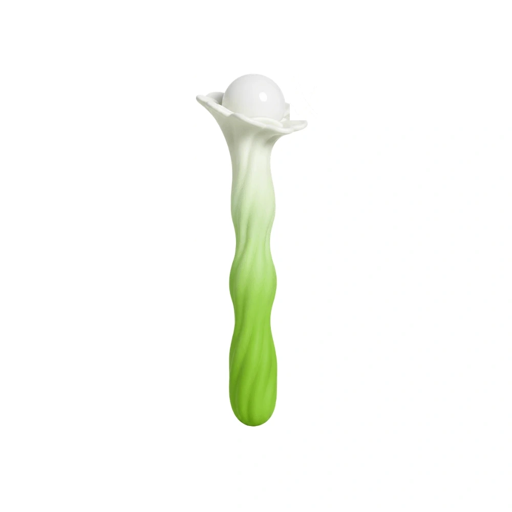 Vibrador verde em formato de planta, com ponta branca e borda em forma de pétalas, sobre fundo branco.